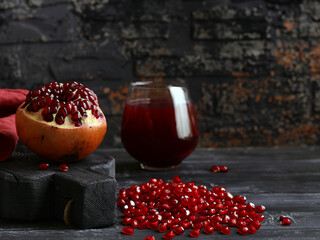 fresh natural organic pomegranate on wooden table