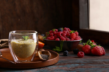 fresh natural organic chia pudding on wooden table