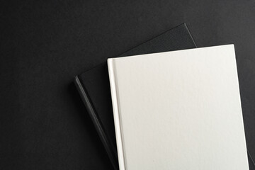 Obraz na płótnie Canvas Hardcover book or notepad mock up on black background