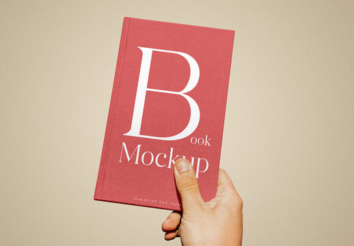 Book Cover in Hand Mockup