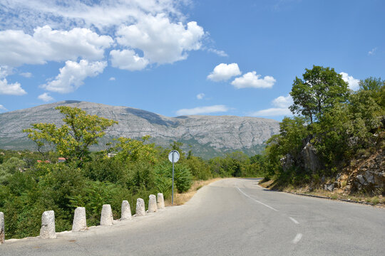 View of Dinara mountain froom road after the stone Balecki bridge across the Cetina river