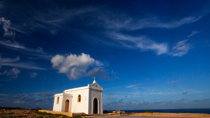 Small white catholics church, Chapel of Immaculate Conception on the seacost of Malta