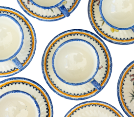 overhead shot of vintage antique tea cups on saucers, transparent background and room for copy