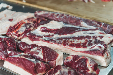 salting the pork at the slaughterhouse and preparing it for the stock. High quality photo