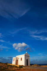 Small white catholics church, Chapel of Immaculate Conception on the seacost of Malta