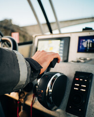 Man holding boat throttle 