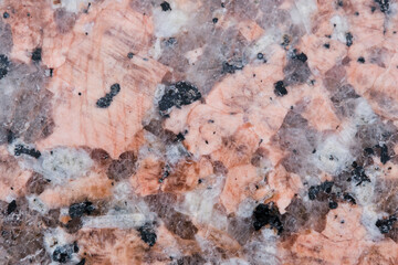 Brown granite chips stone background closeup.