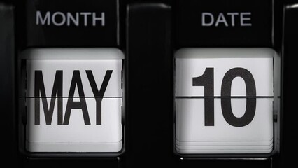 retro flip calendar with a date change from the ninth of May to the tenth of May. daily calendar with a change of days of the month. close up.