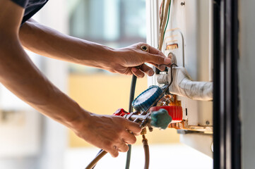 Repairman fix air conditioning systems, Male technician service for repair and maintenance of air...