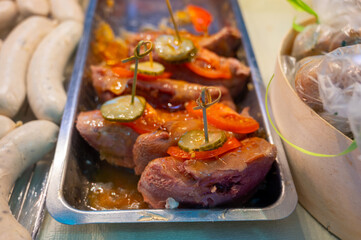 Assortment of meat on weekly food market in France, cow's tongue in jelly