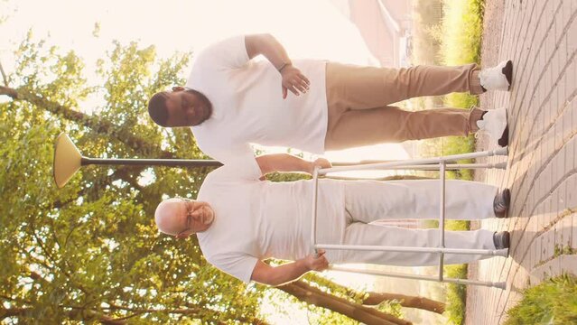 African-American caregiver and old man. Professional nurse and patient in a nursing home. Assistance, rehabilitation and health care concept.