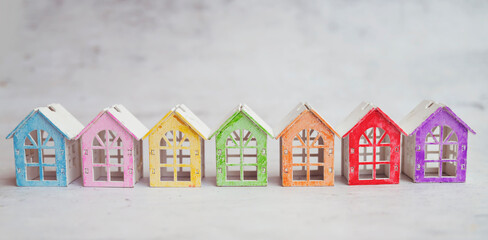 Real estate market concept with colorful wooden houses figurines