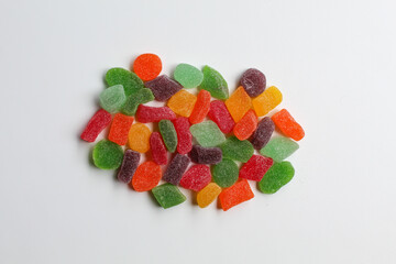 Colorful gummy candy or candied fruit jelly, on white background, flat lay or top view