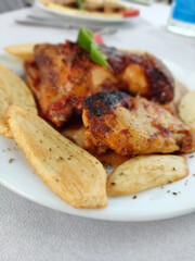 Greek Culinary Delight: Savory Chicken Wings with Greek Potatoes