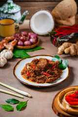 Rendang Pork. Rendang is an Indonesian West Sumatra Minangkabau spicy meat. that slow cooked in coconut milk and mixed spices.