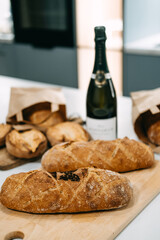 Food and Beverage Pairing. Artisan Bread with Wine on Kitchen Counter