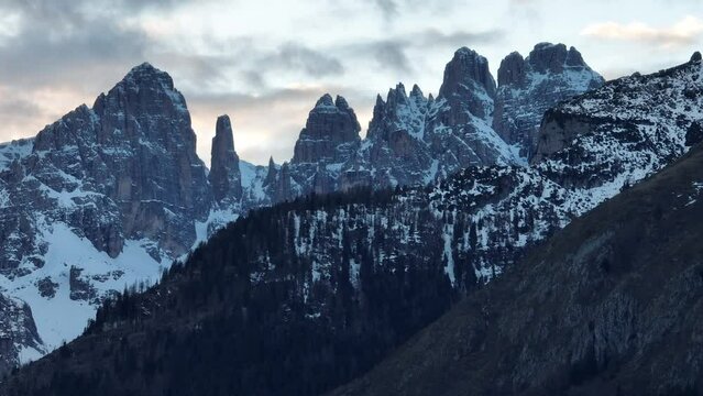 Aerial drone view Andalo town with mountains background in winter. Ski resort Paganella Andalo, Trentino-Alto Adige, Italy.Italian Dolomites Pagnella valley. Snow covered Italian Dolomites at winter.