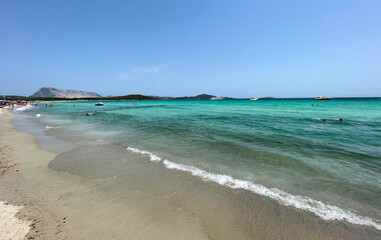 Fototapeta na wymiar Turquoise sea water in Lu Impostu Beach in San Teodoro, Sardinia, Italy