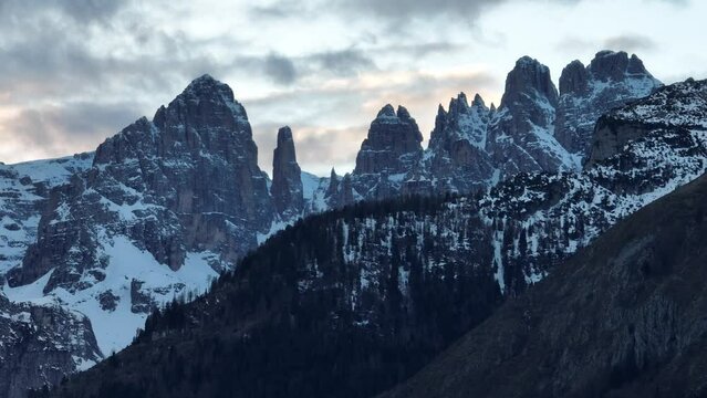 Aerial drone view Andalo town with mountains background in winter. Ski resort Paganella Andalo, Trentino-Alto Adige, Italy.Italian Dolomites Pagnella valley. Snow covered Italian Dolomites at winter.