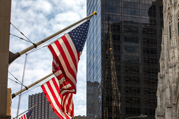 The typical American flags waving in Manhattan, this is the typical decoration of the Big Apple in...