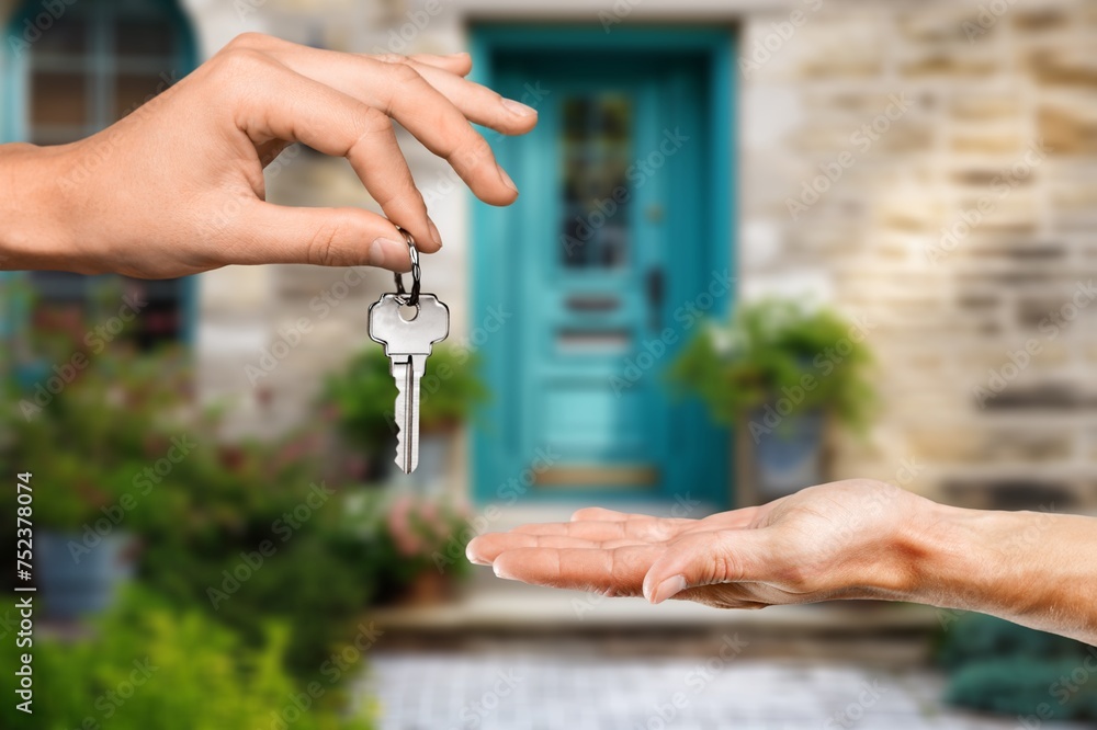 Wall mural Person buying new home holding key