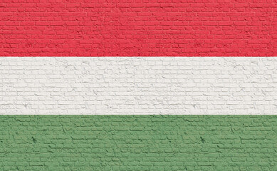 Hungary  flag colors painted on a brick wall. National colors, country, banner, government, Hungarian culture, politics.