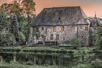 
An old, abandoned stone house, weathered by time and nature, stands as a silent witness to bygone...