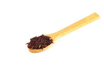 Karkade tea. Hibiscus tea leaves in wooden spoon isolated on white background. File contains clipping path. Top view.