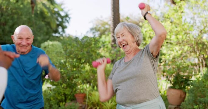 Senior care, old people and caregiver dancing, exercise and physiotherapy in garden for rehabilitation. Energy, happy and weightlifting with dumbbells for muscle training outdoor at nursing home