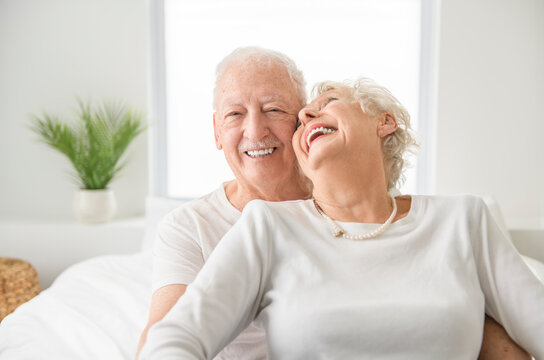 Senior 80 years old Couple Relaxing In Bed together