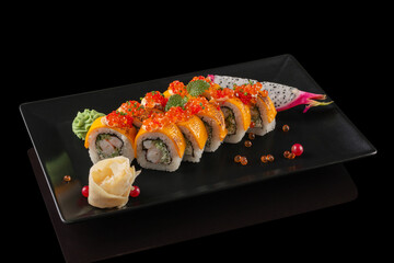 sushi on a black plate