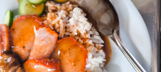 Red pork and crispy pork on rice, food in Thailand
