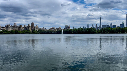 Strolling along the large lake in Central Park which is a public urban park located in the metropolitan district of Manhattan, New York City, (USA).