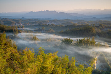 In the morning, smoke curls up from the valley and the bamboo forest is green. The Erliao tribe in...