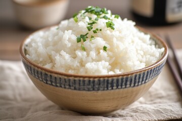 Closeup image of a bowl with freshly cooked rice on display