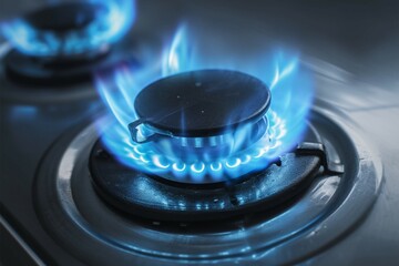 Home cooking scene Gas burner with blue flame in focus