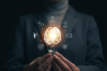 Glowing light bulb in hand, idea search concept Creativity from information trade in the internet world,education , business ideas and target groups.