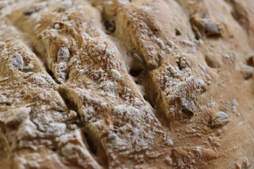 Crunchy tasty handmade freshness with seeds bread backdrop.