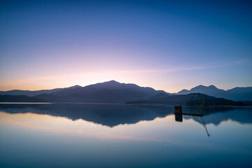 Before sunrise, the view of the dock with lakes and mountains. Sun Moon Lake is one of Taiwan's famous tourist attractions. Nantou county.