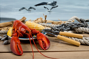 Lobsters on a plate on a seaside dock with driftwood and ropes 