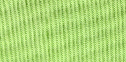 Texture of green fabric as background, top view