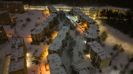 Drone photography of an apartment block in the city during winter night