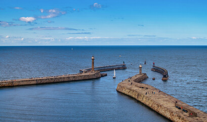 The harbour and lighthouses at daytime in Whitby abbey, North Yorkshire, UK
