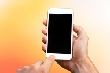 Hand holding modern smartphone with a blank screen