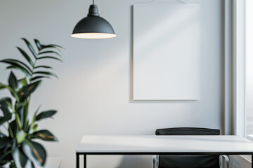 A mockup with a minimalistic workplace in the office: a table with an office chair, a plant and a pendant lamp. There is an empty white canvas hanging on the wall
