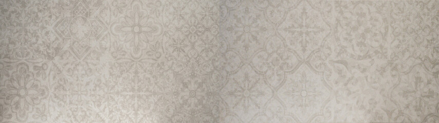 Old gray gray white vintage shabby floral flowers patchwork motif tiles stone concrete cement wall texture background banner wallpaper pattern.