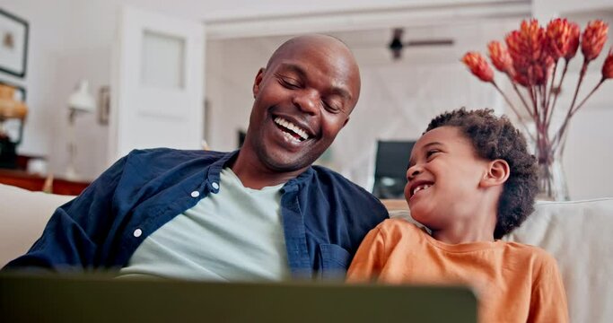 African father, boy and laptop on sofa with laughing, streaming or funny show on internet in lounge. Black man, dad and son with computer for comedy movie, cartoon or bonding with love in family home