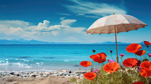 Flowers and umbrella on the beach with blue sky and sea background