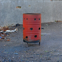 Obraz premium Close Up of Old Rusty Oil Drum Used as Outdoor Incinerator 