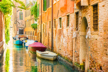 Morning in Venice street with canal, boats and gondolas - 752469041